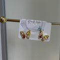 Blush butterfly studs